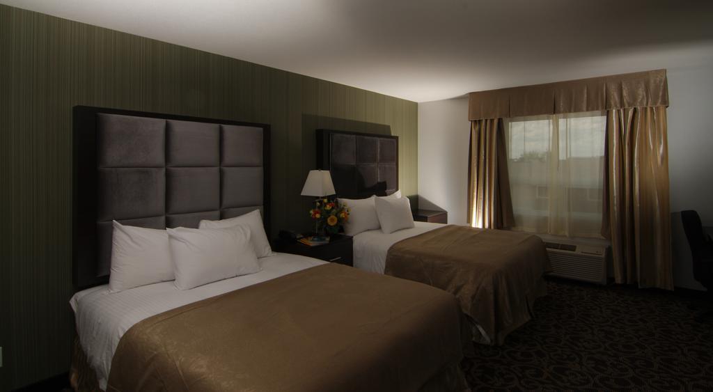 Paradise Inn And Suites Redwater Room photo